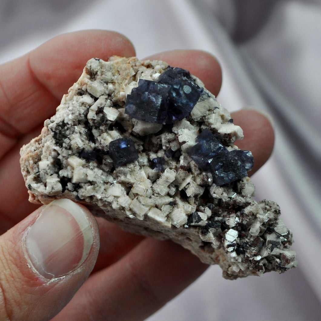 Purple Fluorite in Feldspar with Clevelandite