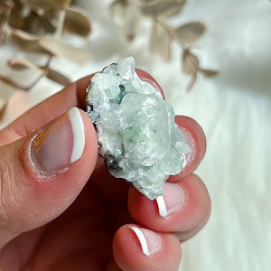 Psuedo Cubic Transparent Calcite Crystal Sitting in a Prehnite Base